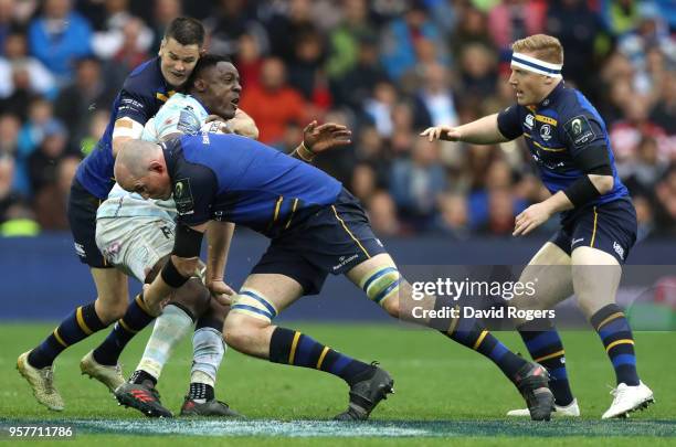 Yannick Nyanga of Racing 92 is tackled by Johnny Sexton of Leinster and Devin Toner of Leinster during the European Rugby Champions Cup Final match...