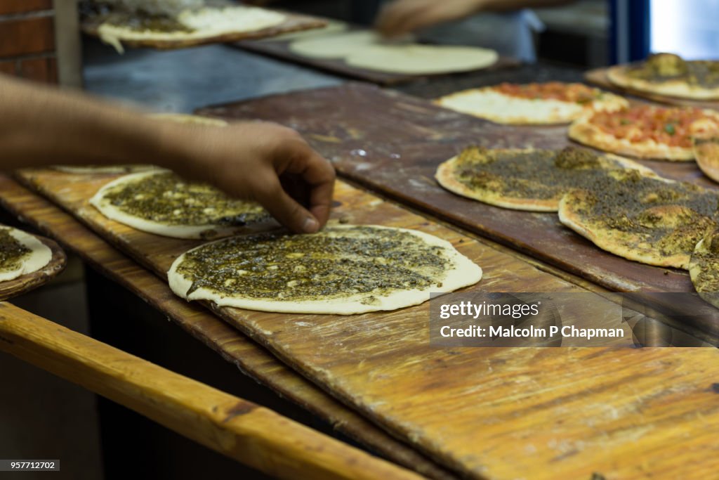 Manouche, Lebanese flatbread, with Zaatar prepared in bakery, Beirut, Lebanon