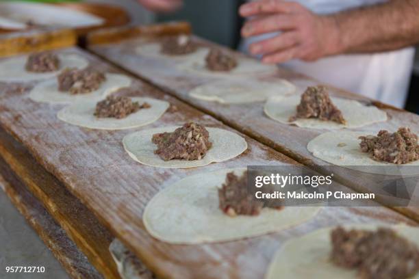 meat filled lebanese flatbreads, freshly made in bakery, beirut, lebanon - beirut people stock pictures, royalty-free photos & images