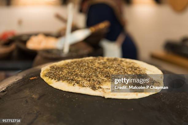 manouche, lebanese flatbread, with zaatar mande on traditional stove, beirut, lebanon - lebanon country stock pictures, royalty-free photos & images