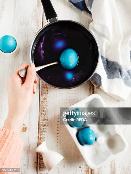 Homemade decoration eggs natural way. Naturally coloring Easter eggs with red cabbage.