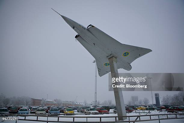 Model of a Saab Gripen fighter jet sits on display outside their factory in Linkoping, Sweden, on Wednesday, Jan. 13, 2010. Saab AB, the Swedish...