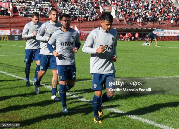 Walter Bou, Julio Buffarini, Junior Benitez and Fernando Gago of Boca Juniors warm up before a match between Huracan and Boca Juniors as part of...