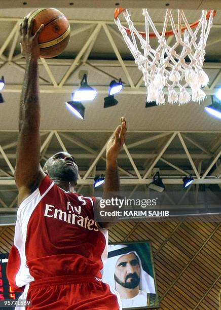Lebanon's al-Riyadi Nate Johnson reaches to the basket during the 21st Dubai International Basketball Championship, against the United Arab Emirates...