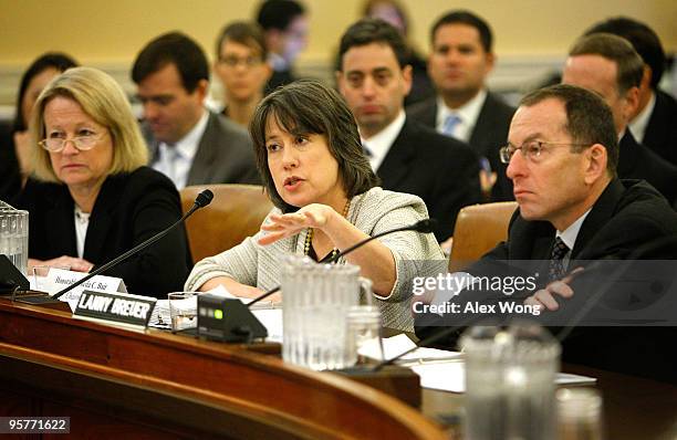 Chairman of the Federal Deposit Insurance Corporation Sheila Bair speaks as Assistant Attorney General Lanny Breuer of the Criminal Division, and...