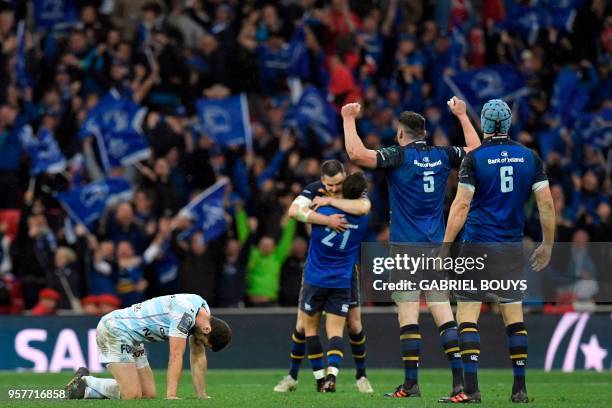 Racing 92's French fly-half Remi Tales reacts as Leinster's players celebrate after the 2018 European Champions Cup final rugby union match between...