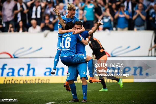 Robin Hack , Nico Schulz and Adam Szalai of Hoffenheim celebrate at the final whistle after the Bundesliga match between TSG 1899 Hoffenheim and...