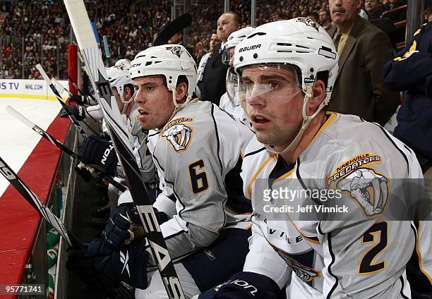 Dan Hamhuis and Shea Weber of the Nashville Predators look on from the bench during their game against the Vancouver Canucks at General Motors Place...