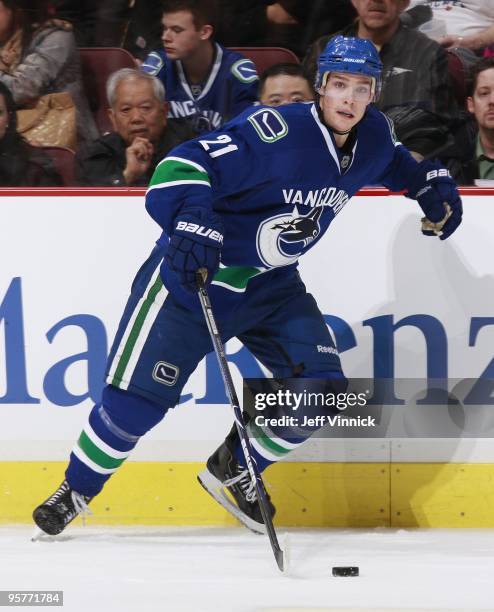 Mason Raymond of the Vancouver Canucks skates up ice with the puck during their game against the Nashville Predators at General Motors Place on...