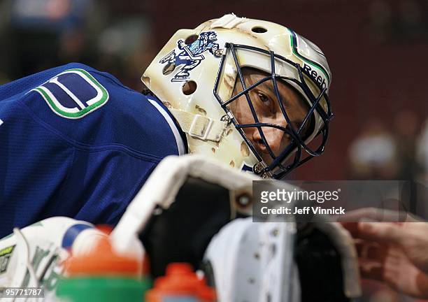 Roberto Luongo of the Vancouver Canucks looks gets his skate blade sharpened during their game against the Nashville Predators at General Motors...
