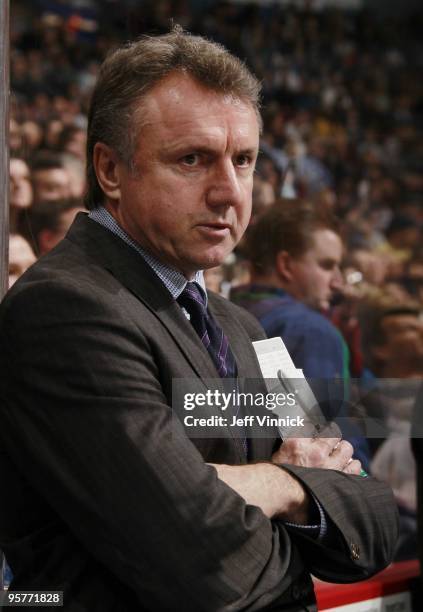 Associate coach Rick Bowness of the Vancouver Canucks looks on from the bench during their game against the Nashville Predators at General Motors...