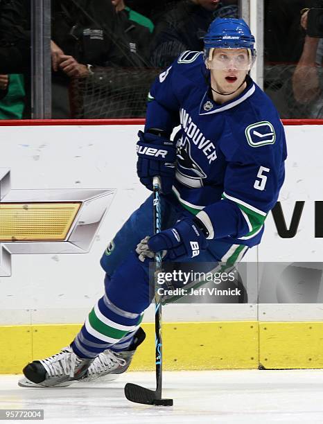 Christian Ehrhoff of the Vancouver Canucks skates up ice with the puck during their game against the Nashville Predators at General Motors Place on...