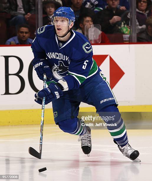 Christian Ehrhoff of the Vancouver Canucks skates up ice with the puck during their game against the Nashville Predators at General Motors Place on...