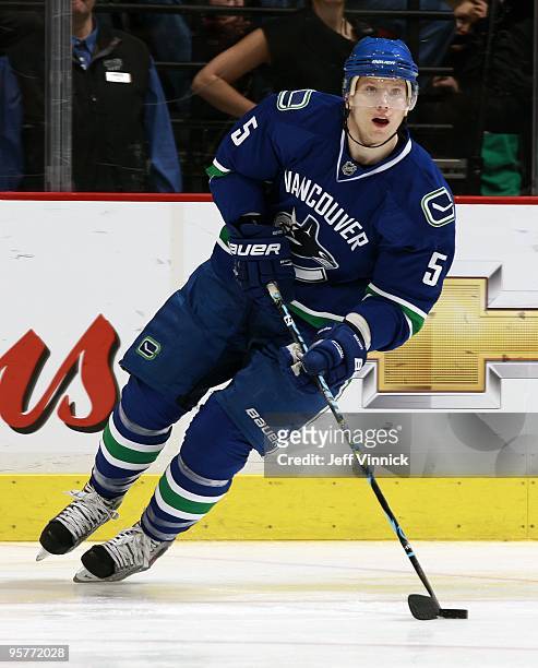 Christian Ehrhoff of the Vancouver Canucks skates up ice with the puck during their game against the Nashville Predators at General Motors Place on...