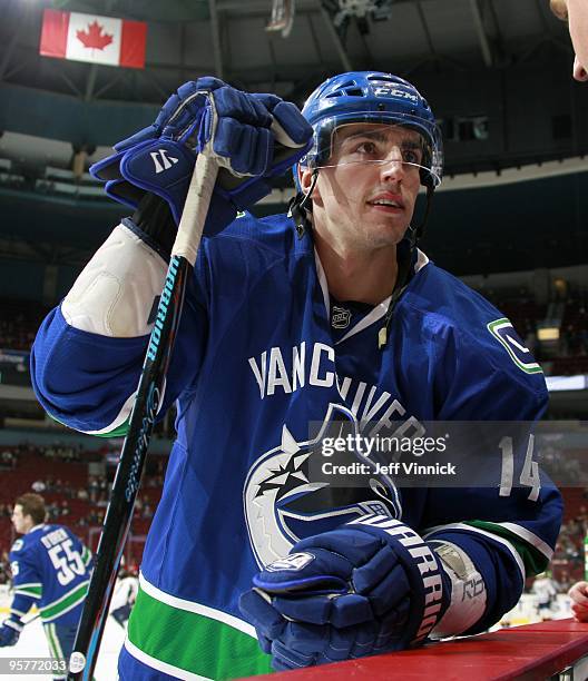 Alex Burrows of the Vancouver Canucks looks on from the bench during their game against the Nashville Predators at General Motors Place on January...