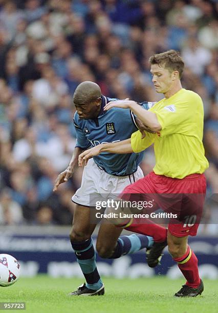 Paulo Wanchope of Manchester City takes the ball past Stephen Hughes of Watford during the Nationwide League Division One match played at Maine Road,...