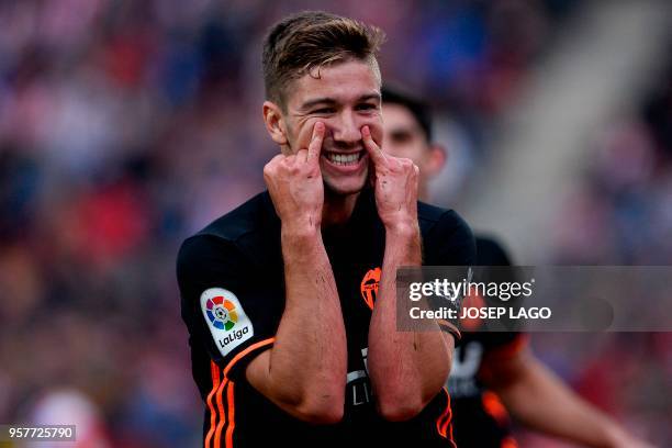 Valencia's Argentinian midfielder Luciano Vietto celebrates his goal during the Spanish league football match Girona FC vs Valencia CF at the...