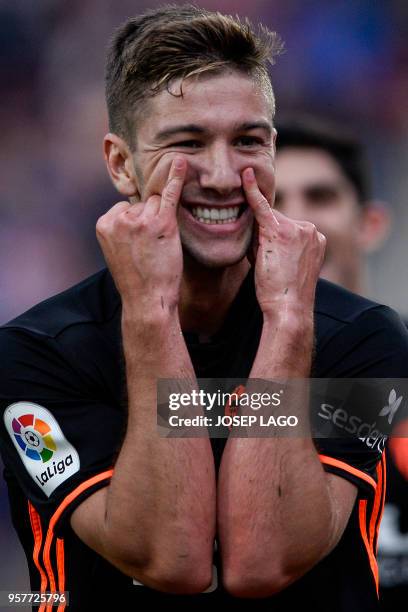 Valencia's Argentinian midfielder Luciano Vietto celebrates his goal during the Spanish league football match Girona FC vs Valencia CF at the...