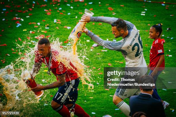 Jerome Boateng gets a beer shower by Sven Ulreich of Bayern after the Bundesliga match between FC Bayern Muenchen and VfB Stuttgart at Allianz Arena...