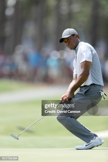 Tiger Woods of the United States reacts as he just misses a birdie putt on the par 4, 15th hole during the third round of the THE PLAYERS...