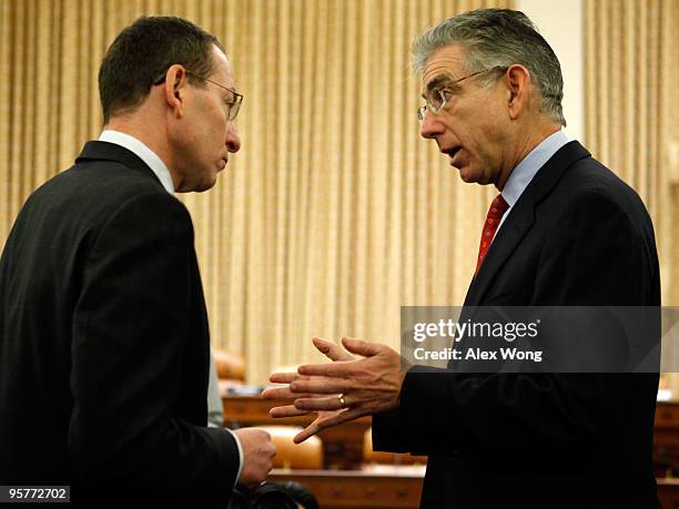 Commission Chairman Phil Angelides talks to Assistant U.S. Attorney General Lanny Breuer of the Criminal Division, after a hearing before the...