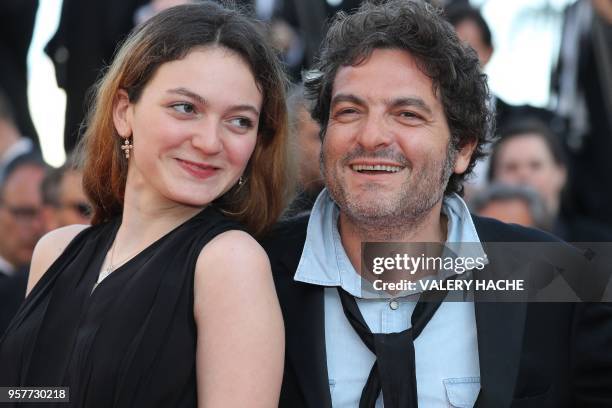 French musician Matthieu Chedid a.k.a M and his daughter Billie pose as they arrive on May 12, 2018 for the screening of the film "Girls of the Sun "...