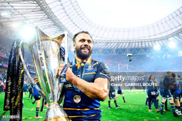 Leinster's New Zealander wing Isa Nacewa celebrates with the trophy after the 2018 European Champions Cup final rugby union match between Racing 92...