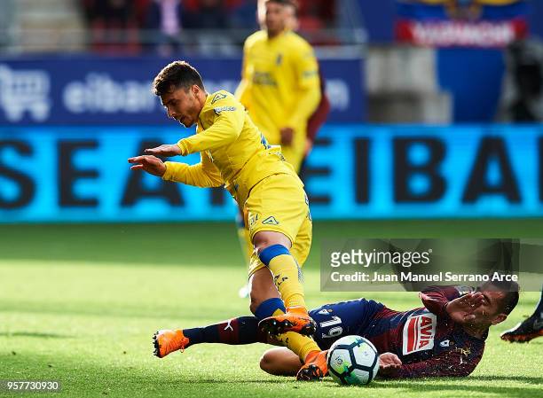 Charles Dias de Oliveira of SD Eibar duels for the ball with Joaquin Navarro 'Ximo' of UD Las Palmas during the La Liga match between SD Eibar and UD...