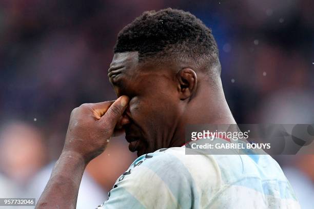 Racing 92's French number eight Yannick Nyanga cries after the 2018 European Champions Cup final rugby union match between Racing 92 and Leinster at...