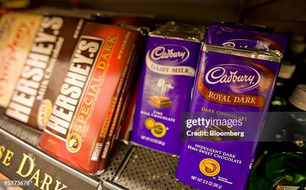 Hershey Co. Hershey's brand and Cadbury Plc brand chocolate bars sit on display in a supermarket in New York, U.S., on Thursday, Jan. 14, 2010....