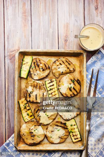 Grilled Seitan. Marinated Zuchini. Thaine Sauce. Italy. Europe.