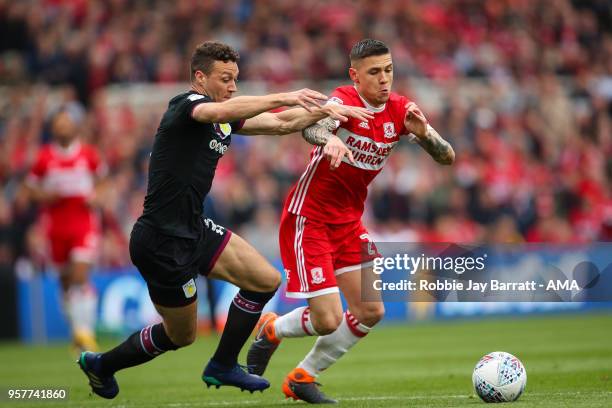 James Chester of Aston Villa and Muhamed Besic of Middlesbrough during the Sky Bet Championship Play Off Semi Final First Leg match between...