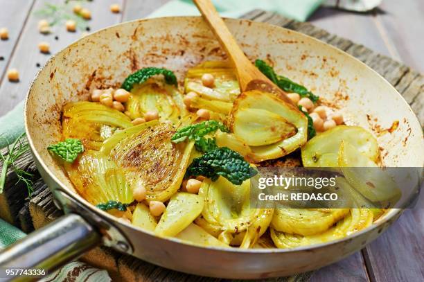 Sliced Fennel Sauted in a Pan with Curcuma. Served with Cickpea and Savory Cabbage Marinated in Umeboshi.