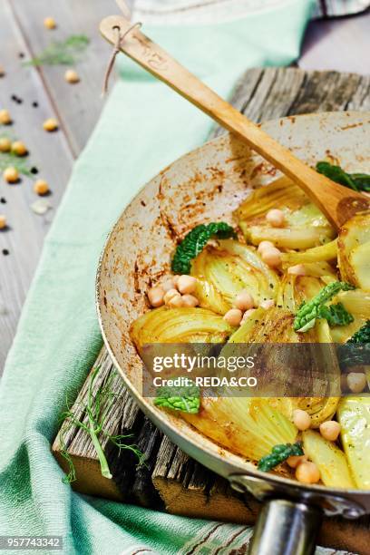 Sliced Fennel Sauted in a Pan with Curcuma. Served with Cickpea and Savory Cabbage Marinated in Umeboshi.