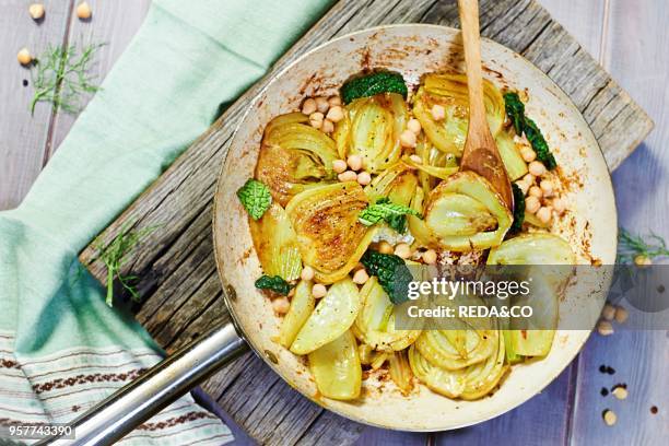 Sliced Fennel Sauted in a Pan with Curcuma. Served with Cickpea and Savory Cabbage Marinated in Umeboshi.