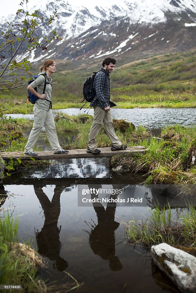 Couple hiking the mountainous outdoors of Alaska