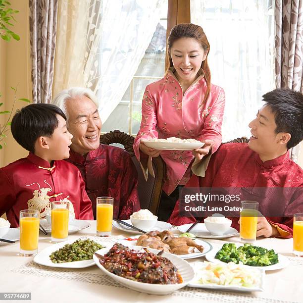 family having chinese new year dinner - stereotypically upper class stock pictures, royalty-free photos & images