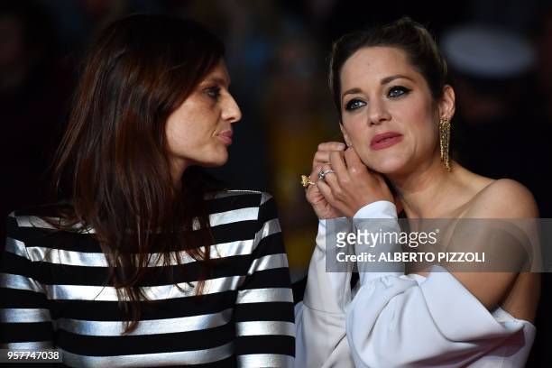 French actress Amelie Daure and French actress Marion Cotillard, arrive on May 12, 2018 for the screening of the film "Gueule d'Ange " at the 71st...
