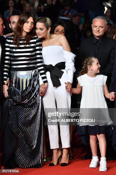 French actress Amelie Daure, French actress Marion Cotillard, and French actress Ayline Aksoy-Etaix, arrive on May 12, 2018 for the screening of the...