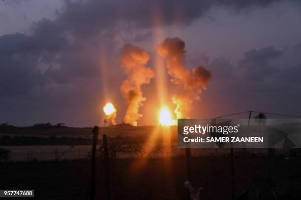 Smoke and fire rises following an Israeli air strike on Beit Hanun in the northern of Gaza Strip, on May 12, 2018.