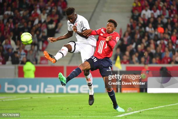 Papy Milson Djilobodji of Dijon and Lebo Mothiba of Lille during the Ligue 1 match between Lille OSC and Dijon FCO at Stade Pierre Mauroy on May 12,...