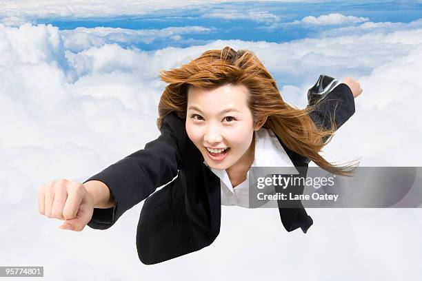 young businesswoman flying through the air - super excited suit stock pictures, royalty-free photos & images