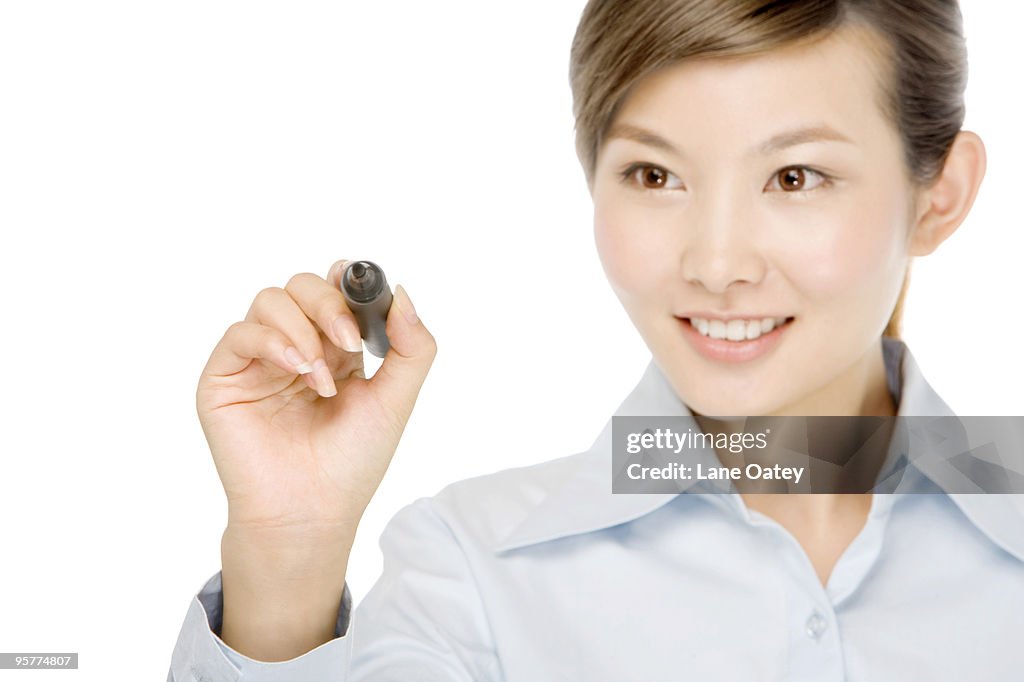 Business Woman Writing On Glass Board