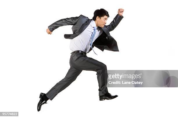 young businessman running fast - running man profile stock pictures, royalty-free photos & images
