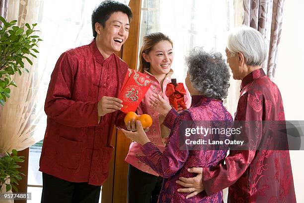 family sending chinese new year gifts - stereotypically upper class stock pictures, royalty-free photos & images