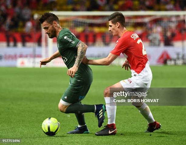 Saint-Etienne's French defender Mathieu Debuchy vies with Monaco's French defender Julien Serrano during the French L1 football match Monaco vs St...