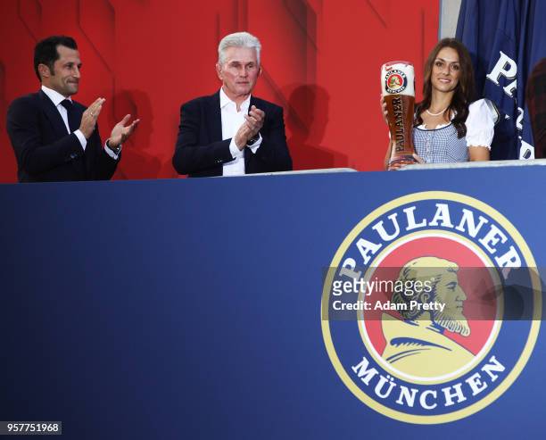 Hasan Salihamidzic sporting director of FC Bayern Muenchen and Jupp Heynckes head coach celebrate winnning the Bundesliga with fans in the beer...