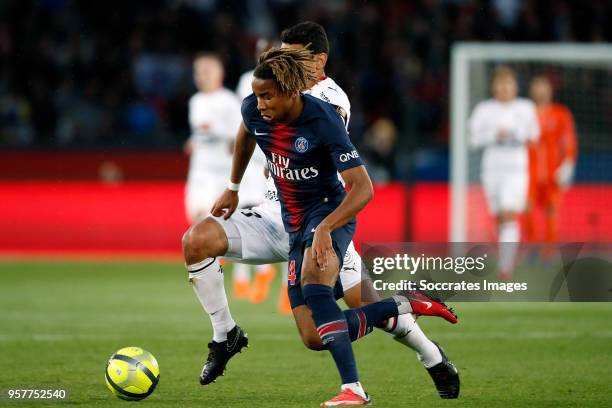 Christopher Nkunku of Paris Saint Germain, Benjamin Andre of Stade Rennes during the French League 1 match between Paris Saint Germain v Rennes at...