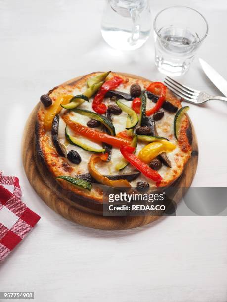 Pizza. Zucchini. Taggiasche Black Olives Red and Yellow Pepper. Italy. Europe.