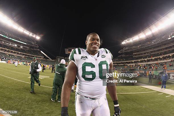 Tackle D'Brickashaw Ferguson of the New York Jets smiles as he leaves the field after the game against the Cincinnati Bengals during their Wildcard...